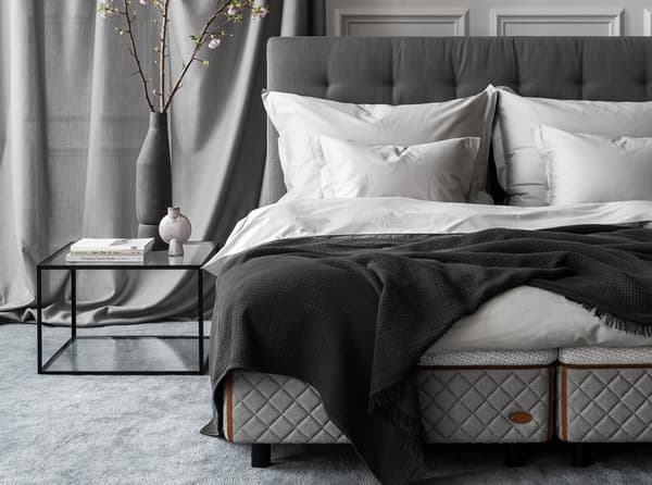 Bedroom environment - DUX bed 2002 with Dante headboard and Alberto table. 